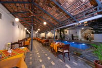 Food Mill tables set beside the pool