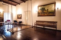 Hall with hanging swing and wooden bench