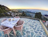 Breakfast table on the terrace above the valley