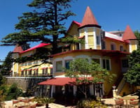 Palace seen across the garden with parasols