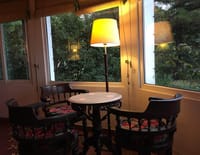 Lounge with standing lamp and bay window
