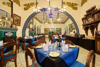 The Turquoise Diner, blue tiled arch and laid tables