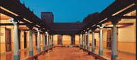 Pillared courtyard colonnade at dusk