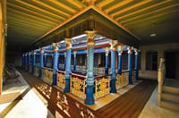 Upper gallery with blue columns and gilded capitals