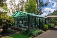 Glass house restaurant seen from the garden