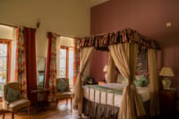 Room with canopied four-poster bed
