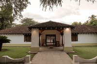 Tiled entrance pavilion with white columns