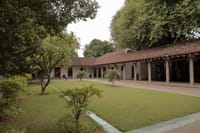 Long tiled-roof wing across a lawn