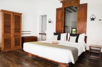 Villa bedroom with teak wardrobe doors