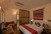 Deluxe room with woven wall hanging