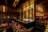 Long bar counter with backlit bottles