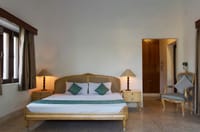 Bedroom with pale walls and side lamps