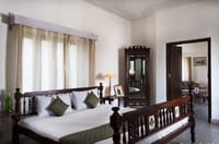 Bedroom with carved wooden bed