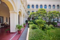 Red-tiled veranda beside the planted courtyard