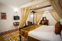 Deluxe room with patterned heritage floor tiles