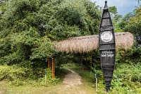The lodge entrance sign made from a dugout canoe
