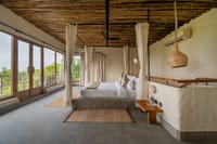 Forest Villa bedroom under a bamboo ceiling