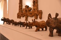 Carved rhinoceros figures on a mantelpiece