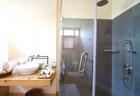 Bathroom with twin basins and rainforest shower