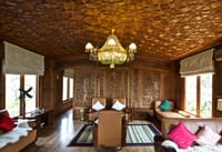 Living room with khatamband ceiling and carved screens