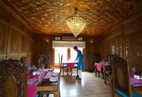 Dining room panelled in carved walnut