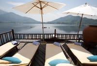 Sun deck loungers facing the lake