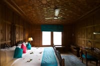 Suite bedroom with khatamband ceiling and writing desk