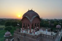 Rooftop chhatri pavilion set for drinks at sunset over Bikaner