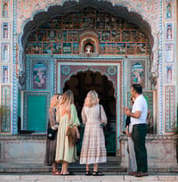 Guests at the haveli's hand-painted blue entrance archway
