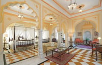 Suite with four-poster bed and tiled floor