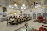 Mirror-work hall with a long dining table