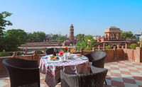 Rooftop terrace table with clock tower view