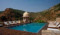 Hilltop pool with domed chhatri and hills