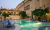 Courtyard pool below the palace wing at dusk
