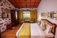 Room with stone wall and framed prints