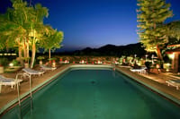 Swimming pool lit at dusk