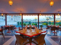 Palki Khana cafe tables under scalloped canopy