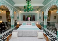 Imperial Suite with green glass chandelier and arches