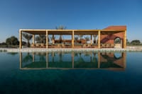 Daytime view across the swimming pool to the Aab cafe pergola