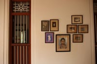 Wall of framed family portraits