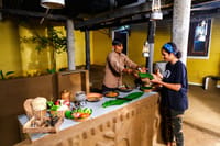 The kitchen serving food on banana leaf at the counter