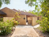 A villa and its garden path by day
