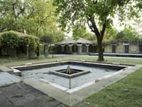 The fire court by day, with the villas behind