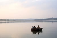 A boat on the Kabini river at sunset