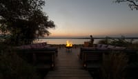 The bonfire and seating deck by the Kabini river at evening