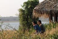Sundowners on a thatched deck by the river