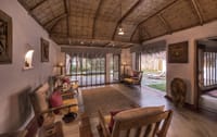 A jungle villa living area with forest views