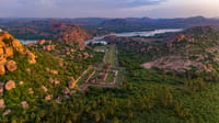 The Hampi ruins from the air, with lake and wildflowers