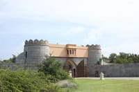 An ancient stone fort entrance and battlements nearby