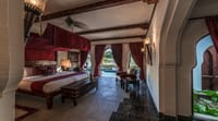 A heritage bedroom with an arched ceiling